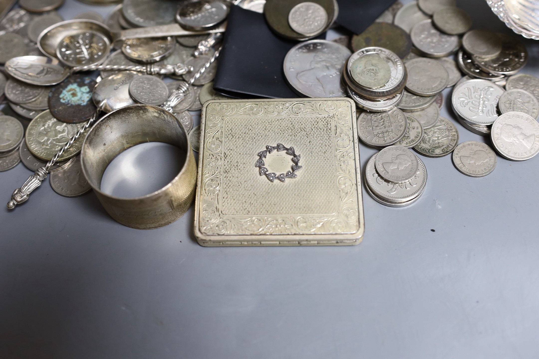 Mixed silver items including a pair of George V pierced silver bowls, weighted, a pair of pierced silver shell dishes, a pair of dwarf candlesticks, a silver napkin ring and other items including compact and assorted coi